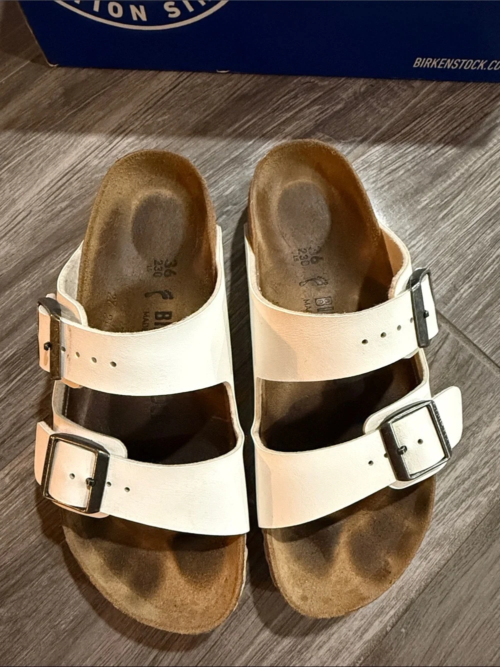 Birkenstock White Two-Strap Arizona Sandals with Silver Buckles